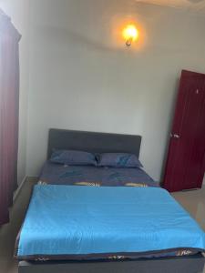 Postel nebo postele na pokoji v ubytování Chengai homestay