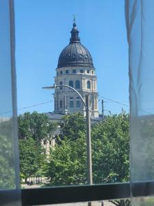 a building with a dome on top of it at Spacious 2BR Apt Downtown, 2 Blocks from State Capitol in Topeka
