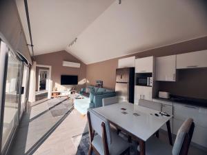 a kitchen and living room with a table and chairs at Bali A 22 in Hurghada