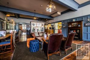 a dining room with a table and chairs at The Brewers Inn in London