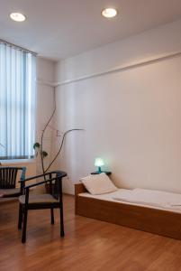 Broadway City Guesthouse客房内的一张或多张床位