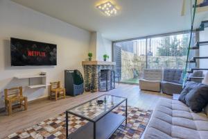 Posezení v ubytování Meadows 2-BR in Tilal Assal
