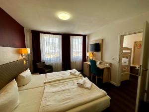 Postel nebo postele na pokoji v ubytování Hotel Wiggers