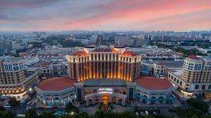 a view of the mgm building at night at Four Points by Sheraton Qingdao, Chengyang in Qingdao