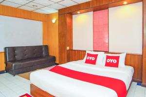 Postel nebo postele na pokoji v ubytování OYO 534 Phasuk Hotel