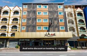 an apartment discount on booking nights in a building at Collection O JA Siam City in Pattaya