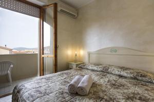 Postel nebo postele na pokoji v ubytování Morpheo Rooms
