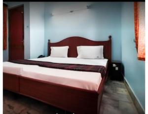 Voodi või voodid majutusasutuse Karthick Lodge, Rameswaram toas