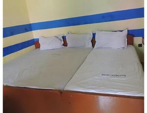 Voodi või voodid majutusasutuse Karthick Lodge, Rameswaram toas