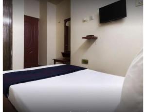 Voodi või voodid majutusasutuse Karthick Lodge, Rameswaram toas
