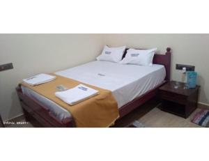 Voodi või voodid majutusasutuse Karthick Lodge, Rameswaram toas