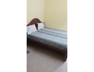 Voodi või voodid majutusasutuse Karthick Lodge, Rameswaram toas