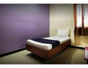 Voodi või voodid majutusasutuse Karthick Lodge, Rameswaram toas