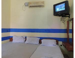 Voodi või voodid majutusasutuse Karthick Lodge, Rameswaram toas