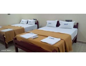 Voodi või voodid majutusasutuse Karthick Lodge, Rameswaram toas
