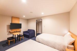 Postel nebo postele na pokoji v ubytování Sotetsu Fresa Inn Nagano-Ueda + 21 fotografií