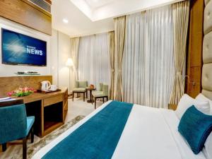 Postel nebo postele na pokoji v ubytování Hotel Jupiter At Delhi Airport