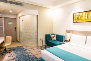 Postel nebo postele na pokoji v ubytování Hotel Jupiter At Delhi Airport