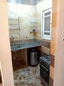 a kitchen with a counter and a sink and a stove at شقة مفروشة للايجار فى راس البر سادس مطل من البحر in Ras El Bar