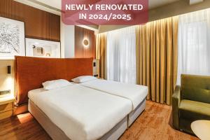 Posteľ alebo postele v izbe v ubytovaní Qubus Hotel Wrocław