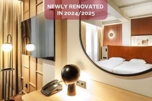 Posteľ alebo postele v izbe v ubytovaní Qubus Hotel Wrocław