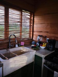 a kitchen with a sink and a counter top at Casa Ágata in El Puertecito +25 photos