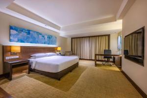 Krevet ili kreveti u jedinici u okviru objekta Hyatt Regency Kinabalu