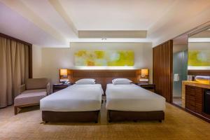 Krevet ili kreveti u jedinici u okviru objekta Hyatt Regency Kinabalu