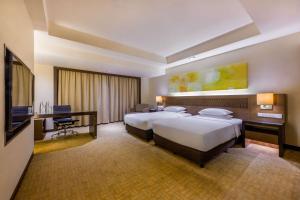 Krevet ili kreveti u jedinici u okviru objekta Hyatt Regency Kinabalu