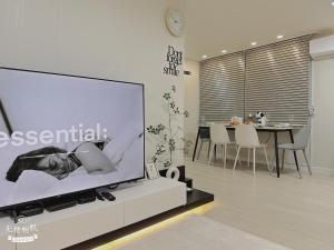 a large screen tv in a living room with a table at Jaha 79 in Seoul