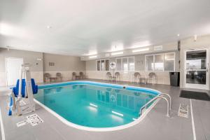 a large swimming pool in a hotel room at Comfort Inn Great Falls South in Great Falls