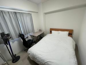 Postelja oz. postelje v sobi nastanitve 篠原橋マンション