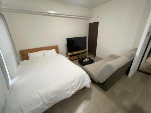 Postelja oz. postelje v sobi nastanitve 篠原橋マンション
