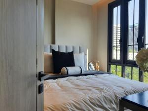 a bedroom with a large bed and a window at Luxury Japanese Onsen Reserve - Bangkok in Bangkok +25 photos
