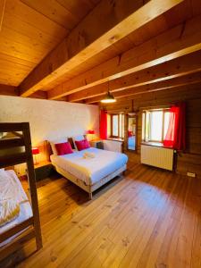 En eller flere senge i et værelse på Le Lodge des Aulps