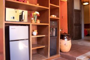 a kitchen with a refrigerator in a room at Habitación individual zona centro in Zacatlán