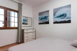 Łóżko lub łóżka w pokoju w obiekcie Villas & Apartamentos Tao Mazo