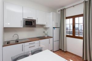 Kuchnia lub aneks kuchenny w obiekcie Villas & Apartamentos Tao Mazo