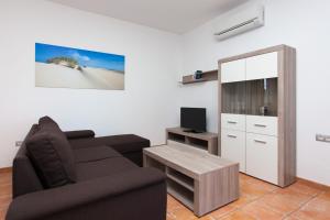 Telewizja i/lub zestaw kina domowego w obiekcie Villas & Apartamentos Tao Mazo