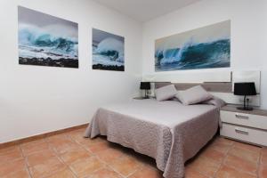 Łóżko lub łóżka w pokoju w obiekcie Villas & Apartamentos Tao Mazo