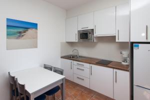 Kuchnia lub aneks kuchenny w obiekcie Villas & Apartamentos Tao Mazo