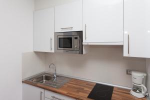 Kuchnia lub aneks kuchenny w obiekcie Villas & Apartamentos Tao Mazo