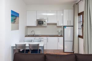 Kuchnia lub aneks kuchenny w obiekcie Villas & Apartamentos Tao Mazo