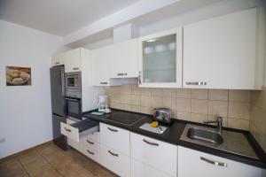 Kuchnia lub aneks kuchenny w obiekcie Villas & Apartamentos Tao Mazo