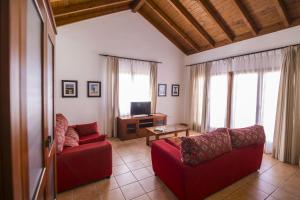 Telewizja i/lub zestaw kina domowego w obiekcie Villas & Apartamentos Tao Mazo