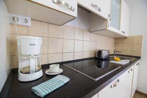 Kuchnia lub aneks kuchenny w obiekcie Villas & Apartamentos Tao Mazo