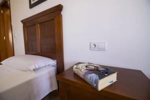 Łóżko lub łóżka w pokoju w obiekcie Villas & Apartamentos Tao Mazo