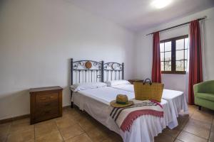 Łóżko lub łóżka w pokoju w obiekcie Villas & Apartamentos Tao Mazo