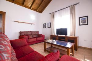 Telewizja i/lub zestaw kina domowego w obiekcie Villas & Apartamentos Tao Mazo