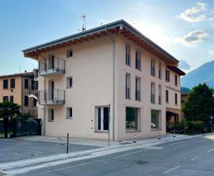 a large white building on the side of a street at Ava home - apartment in the center Camonica Valley in Boario Terme